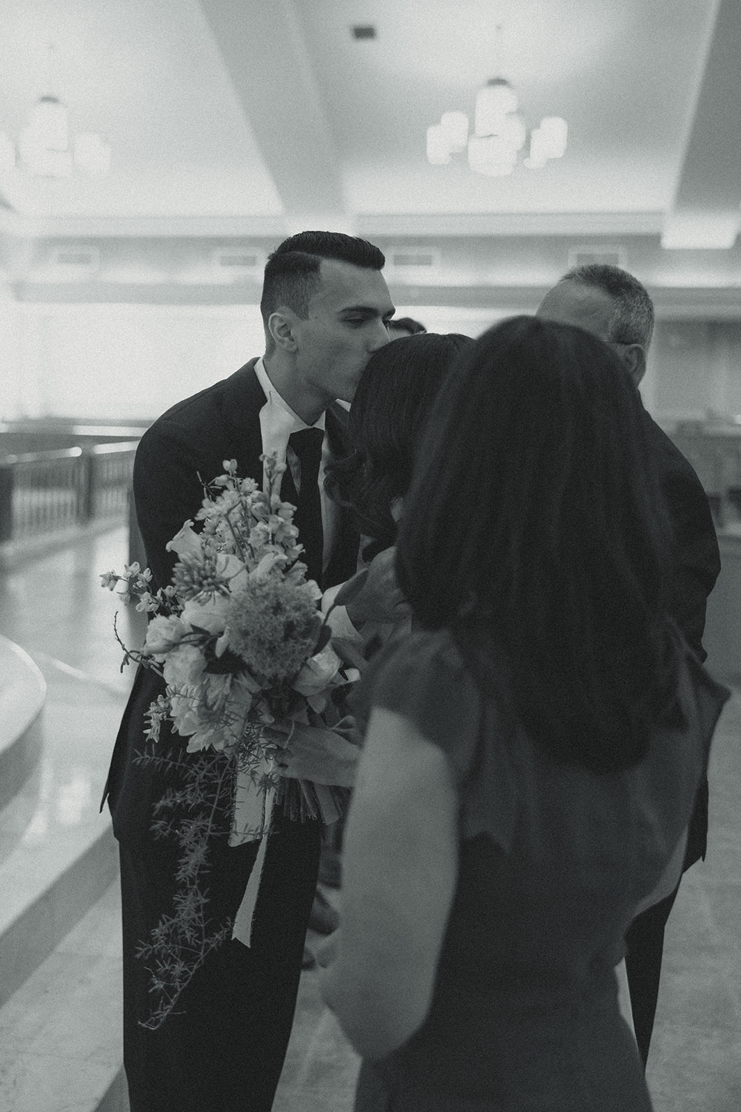 Documentary Wedding Church Ceremony Miami Wedding Photographer Black and White Groom kissing bride