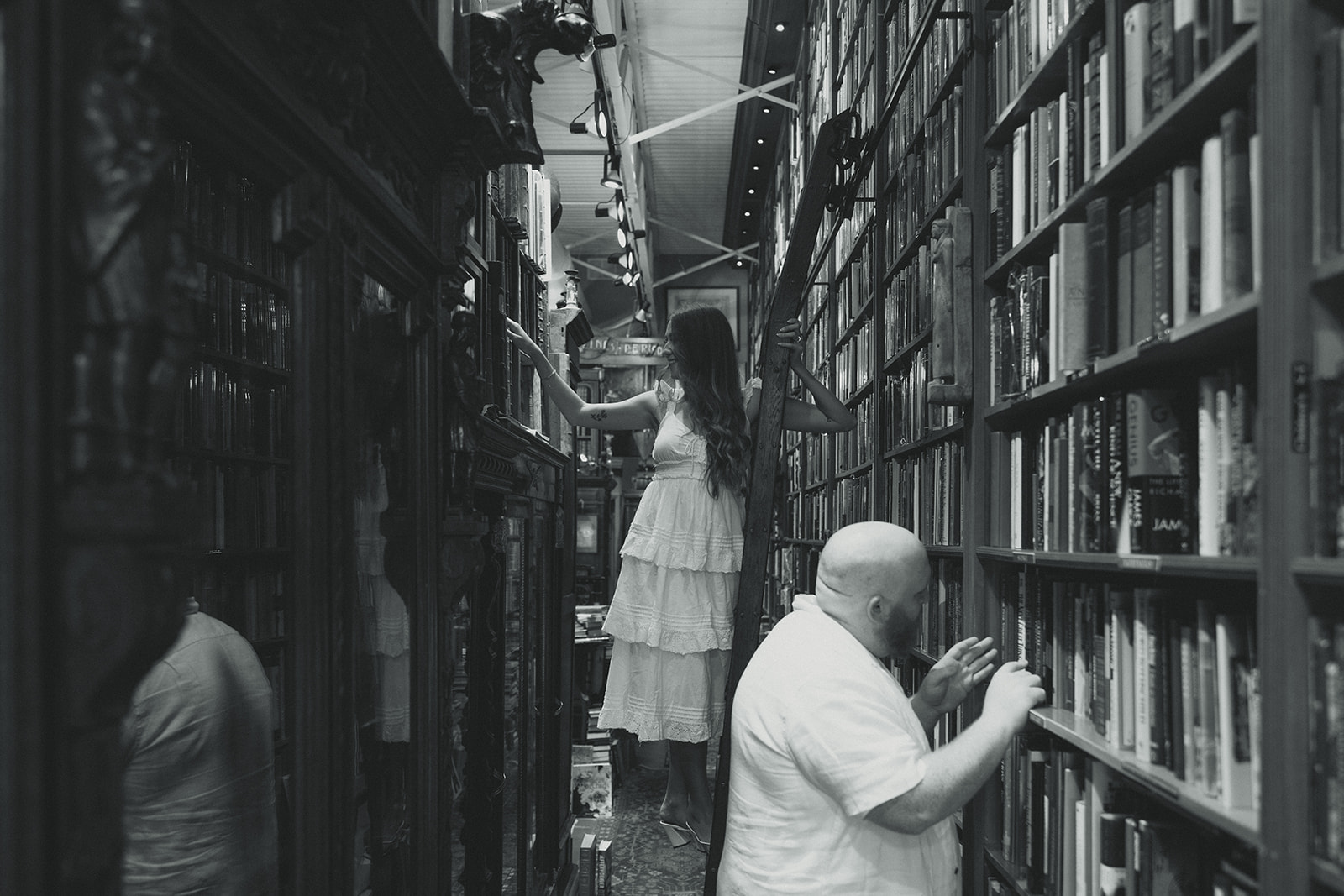 Black and White Bookstore Movie Scene Engagement Session