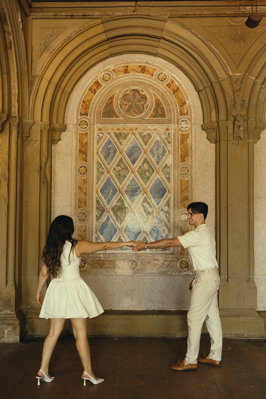 Bethesda Terrace Arcade. Documentary Engagement Photos of Dancing Couple in Central Park, New York