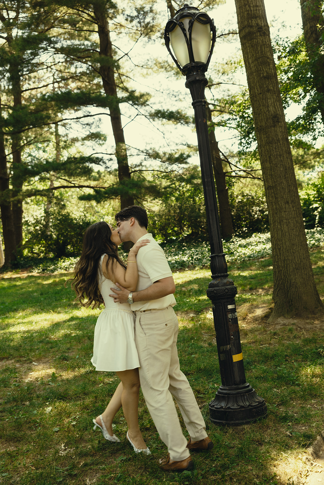 Vintage and Playful Engagement Couples Photos in Central Park New York City, NY of Kissing Couple