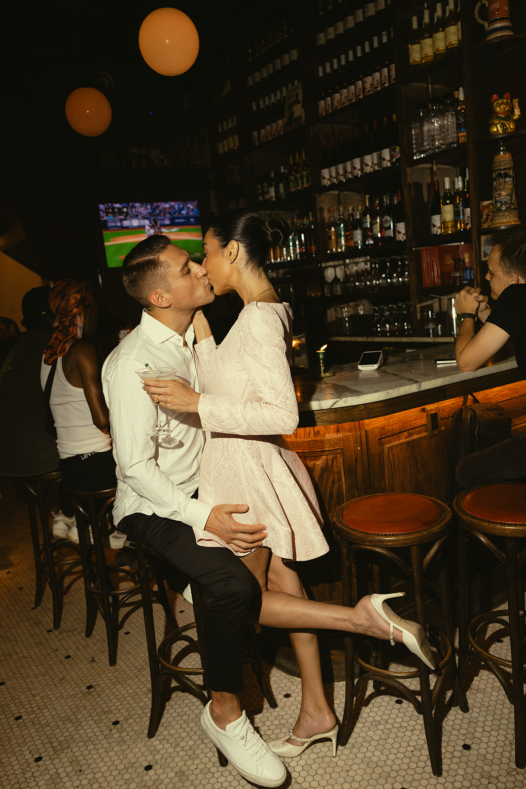 Pre Wedding Editorial Engagement Photos in New York Bar Kissing Couple