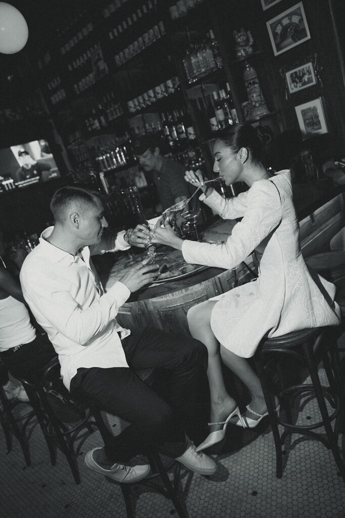 Black and White editorial Couple Eating Pizza Engagement Photos in New York City